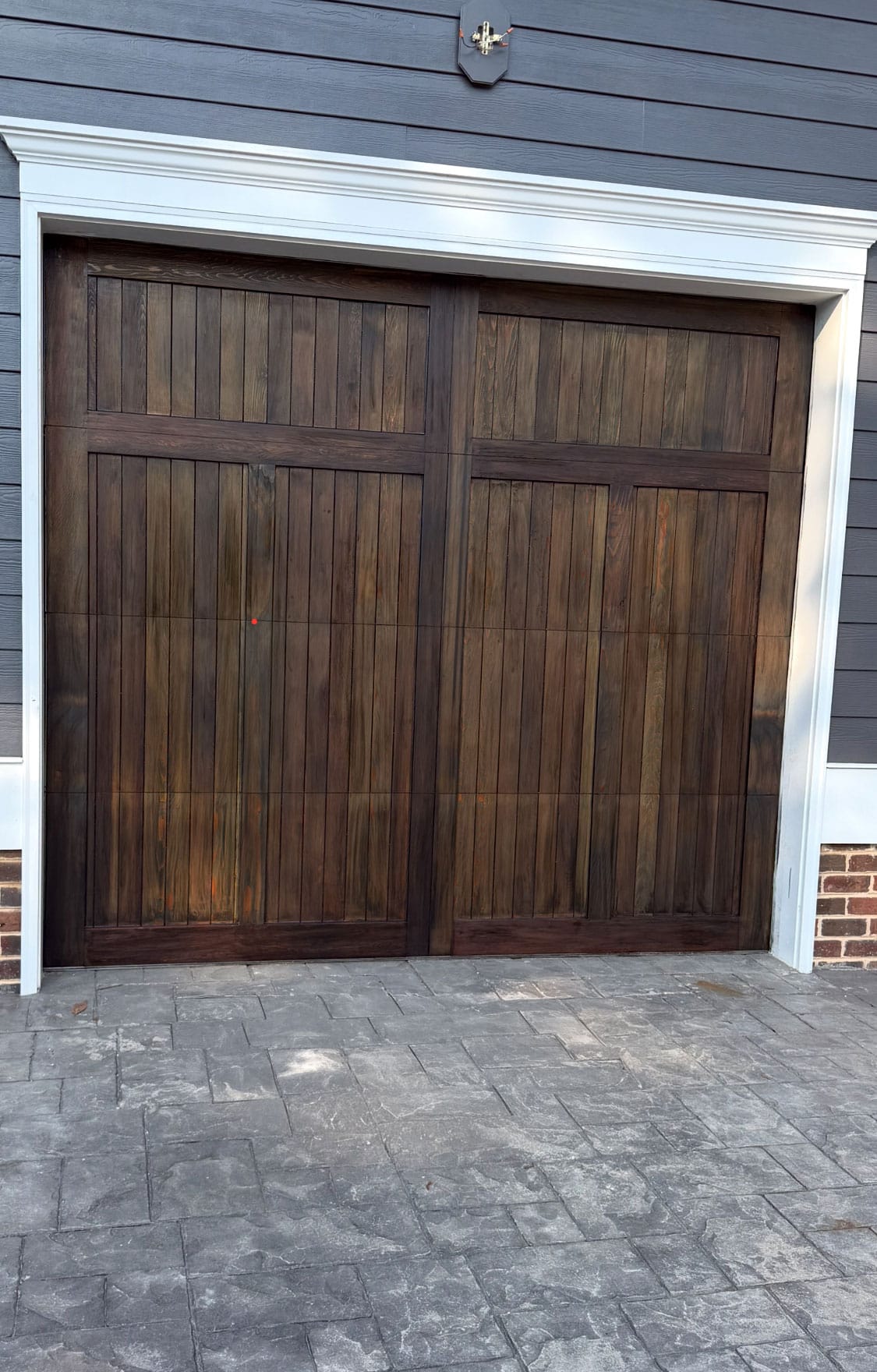 Freshly stained wood garage door