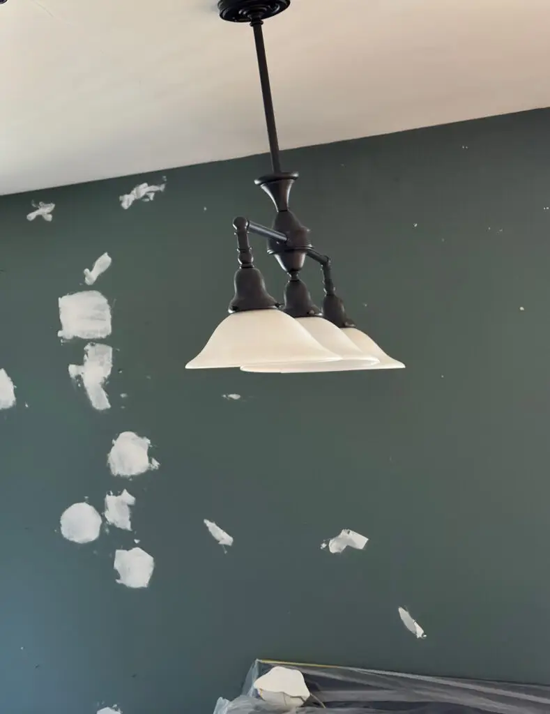Interior wall covered in drywall patches waiting for primer before painting