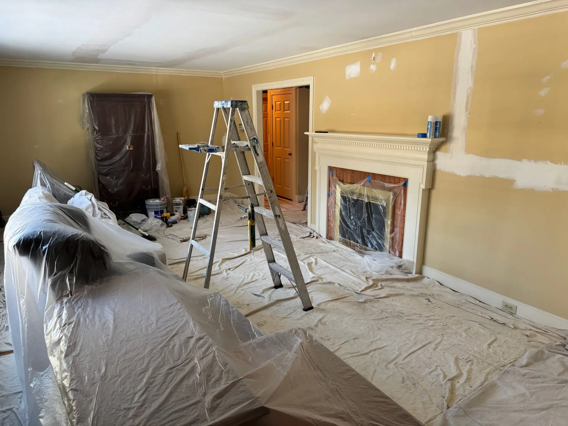 Interior room masked and patched for drywall repair before painting in a Williamsburg VA home